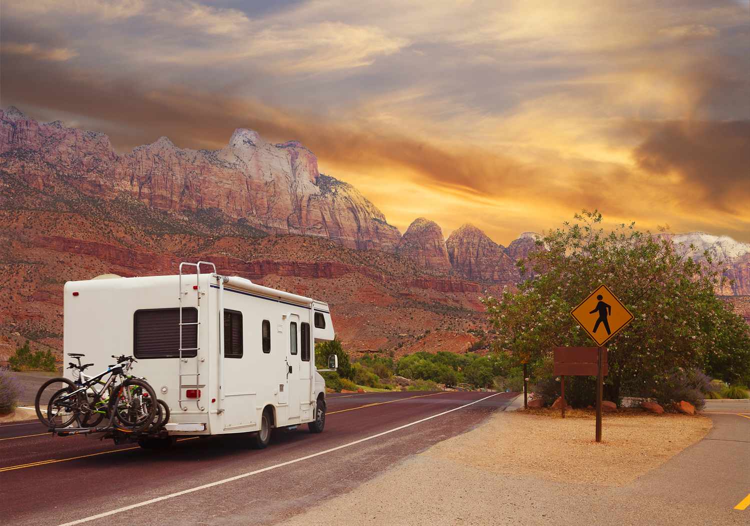 RV driving on a scenic highway, representing the freedom of RV travel with proper insurance.